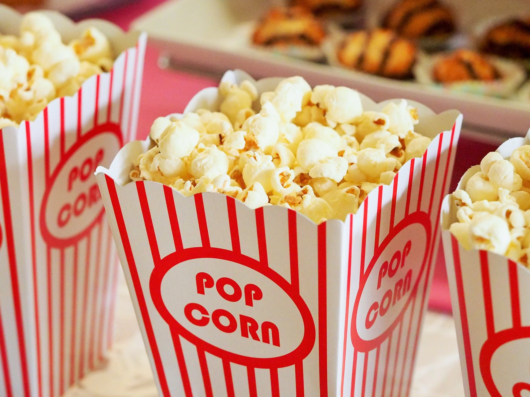 popcorn in white and red striped containers